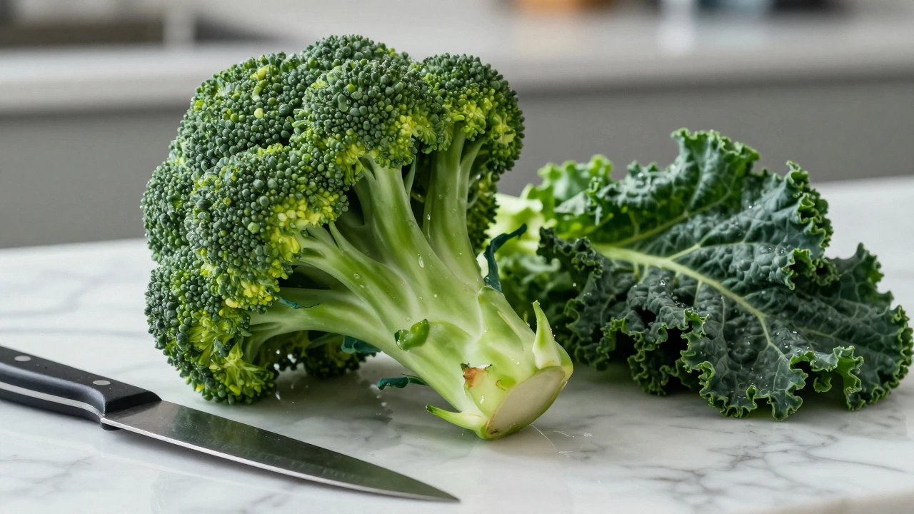 Fresh broccoli and kale on a marble counter with a knife