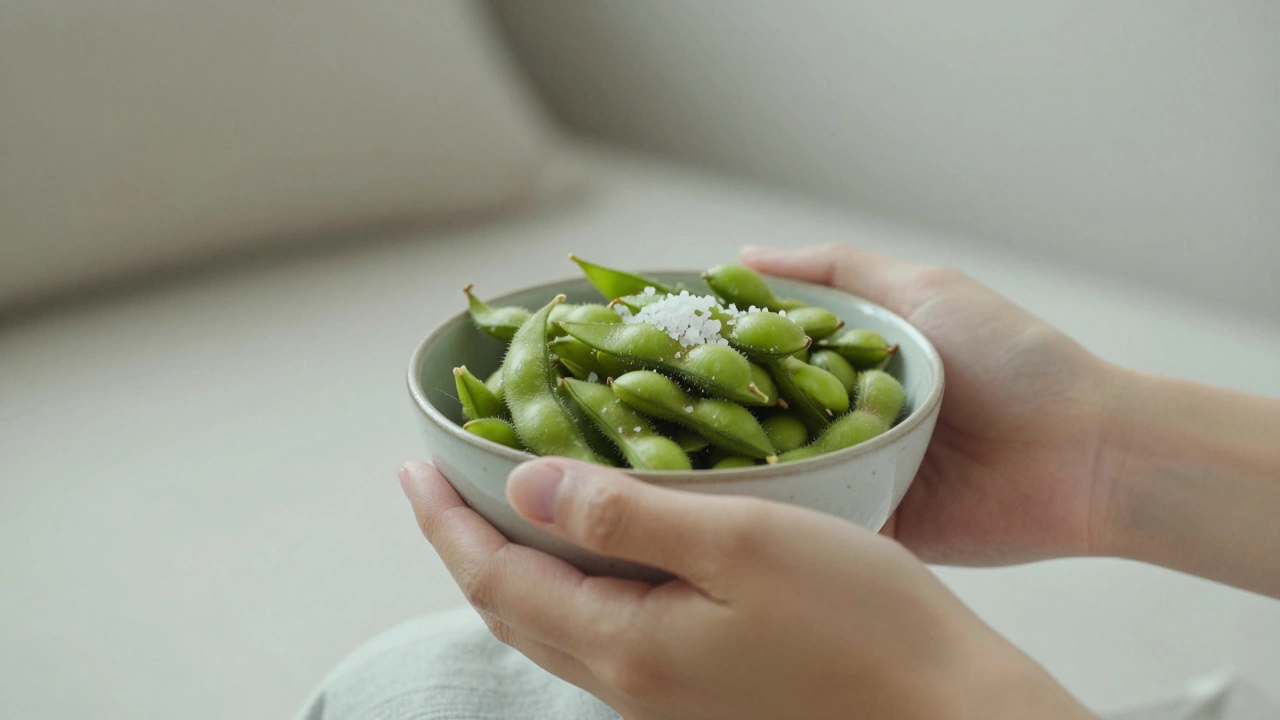 Hands holding a bowl of edamame in a calm, cozy home setting for mindful eating